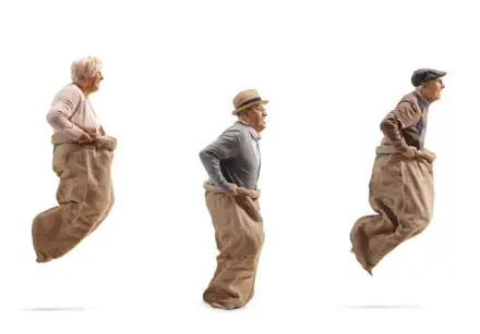 Older people in a sack race
