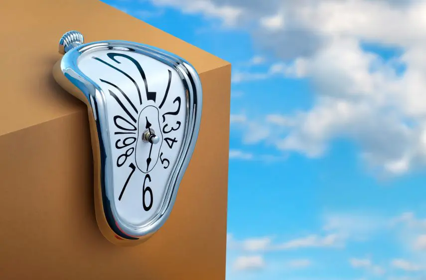 Image of a clock melting over the edge of a box.