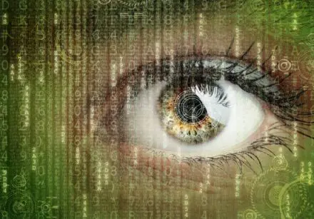 Woman's eye with digital image overlain over
