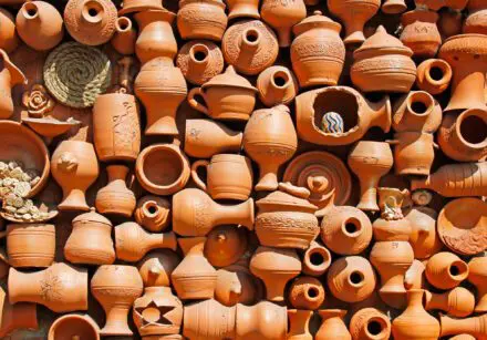 Background of lots of handmade ceramic clay brown terracotta pots