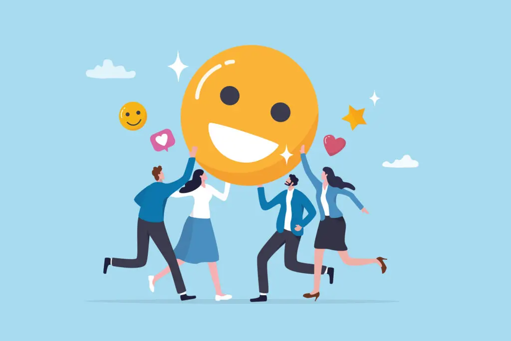 Cartoon image of 2 males and two females having fun holding up a large yellow smiley face, as if it was a giant balloon. The background is a blue sky. The men are wearing dark blue trousers and light blue tops, one woman is wearing a light blue skirt and white blouse, while the other is wearing a dark blue skirt, white blouse and light blue open jacket.