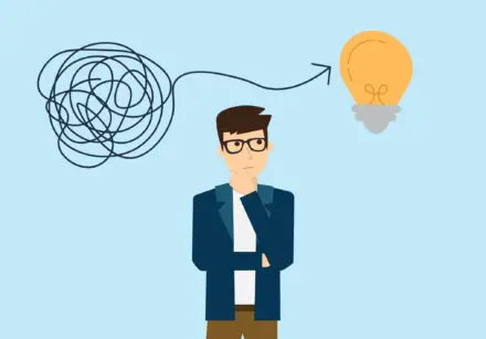 Cartoon image of a young man with dark hair and glassed looking like he's figuring something out. Above his head is a tangle of string with an arrow leading towards a bright lightbulb. He is wearing a blue jacket, white t-shirt and brown trousers.