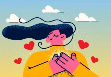 Cartoon illustration of woman with flowing hair in the wind, clouds in the pale green sky behind. She has her hands on her heart and there's red hearts emanating from her heart. She's wearing a mustard coloured top.