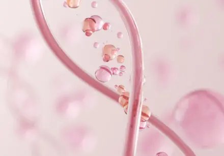 Illustration of kind genes. Two pink strands in a helix pattern with faded pink cells in the background.