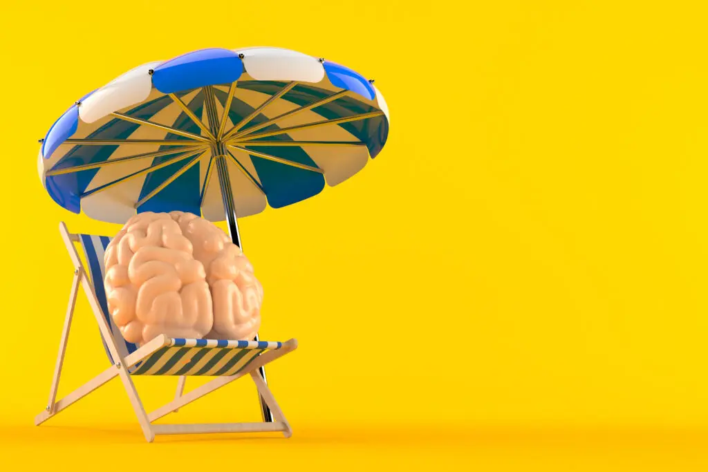 Image depicting brain rest. Brain sitting on a blue-white striped deck chair with a blue and white parasol above it. The background is an egg-yolk yellow.