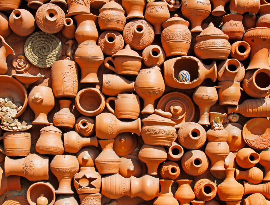 Background of lots of handmade ceramic clay brown terracotta pots